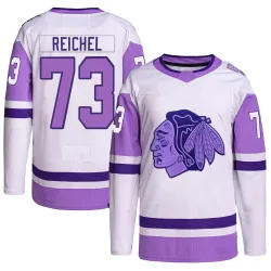 Youth Lukas Reichel Chicago Blackhawks Hockey Fights Cancer Primegreen Jersey - White/Purple Authentic